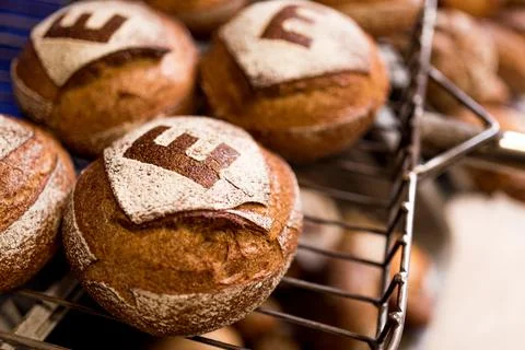 Close up of fresh cooked spelt bread with flour on shelf after baking. fresh  Stock Photos