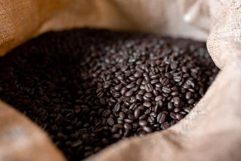 Close up of fresh dark roasted coffee inside of a sack Stock Photos