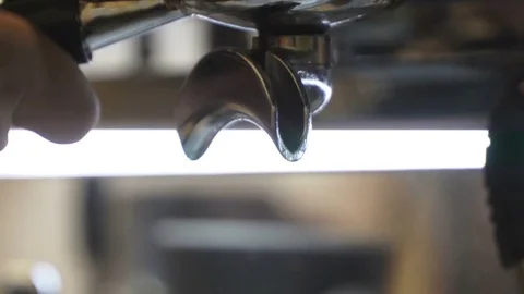Close-up fresh espresso pours in disposable paper cup, Italian espresso machine Stockbeeldmateriaal 80551915