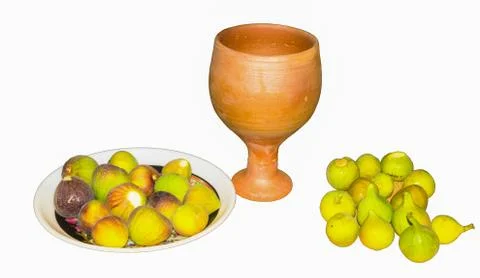 Close up of fresh fig fruit in a plate with clay glass isolated Stock Photos