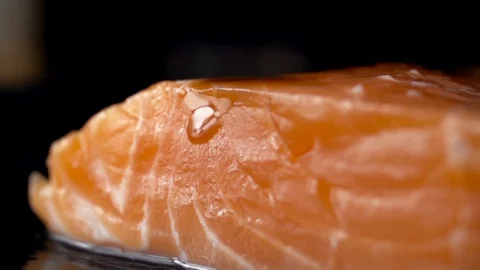Close-up fresh fish salmon on a stone board Stock Footage 105475585