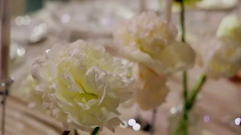 A close-up of the fresh flowers that stand on the festive table Stock Footage 339773385