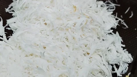 Close up of fresh grated coconut meat. Stock Footage 340506361