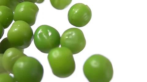 Close-up of the fresh green peas bouncing up and down on the white background Video stock 277743264