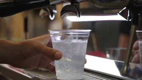 Close-up fresh iced coffee, cold coffee with ice in disposable transparent cup Stock Footage 82214222
