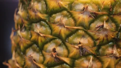 Close-Up of Fresh Juicy Pineapple Rings in a Carved Shell Stock Footage 345645706
