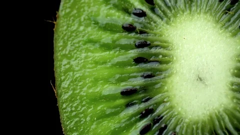 Close-up fresh kiwi cutting fruit on black background Video stock 105416309