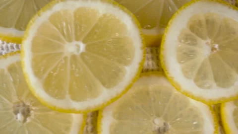 Close up of fresh lemon cut in slices on white background Stock Footage 134069122