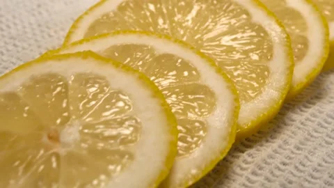 Close up of fresh lemon cut in slices on white background Stock Footage 134069135