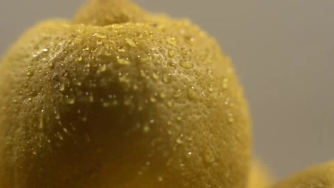 Close up of a fresh lemon rotating Stock Footage 169486272