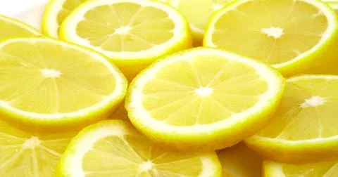 Close up fresh lemon slices pattern background. Bright juicy slice lemon Texture Stock Photos