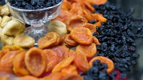 Close-up of Fresh Medjool Dates and Dried Fruits Displayed in Market Baskets Stock Footage 310938518