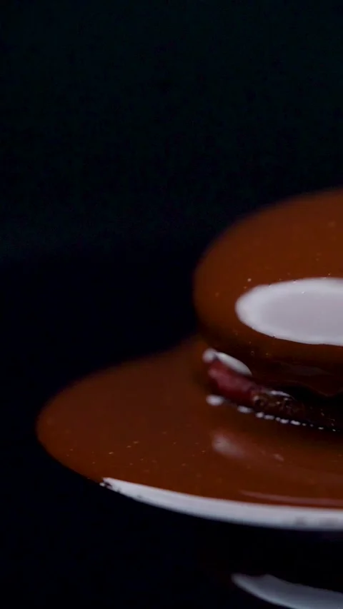 Close Up Fresh Melted Chocolate Dripping on Cream Filled Dessert Stock Footage 330516768