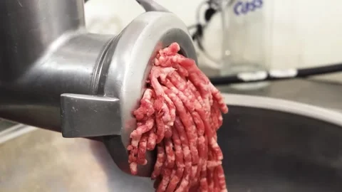 Close-up of Fresh Minced Beef Coming Out of an Electric Meat Grinder Stock Footage 331632812