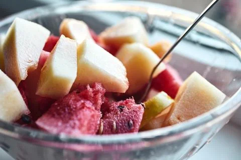 Close-up of fresh mixed fruit salad with watermelon and melon pieces in a bow Stock Photos