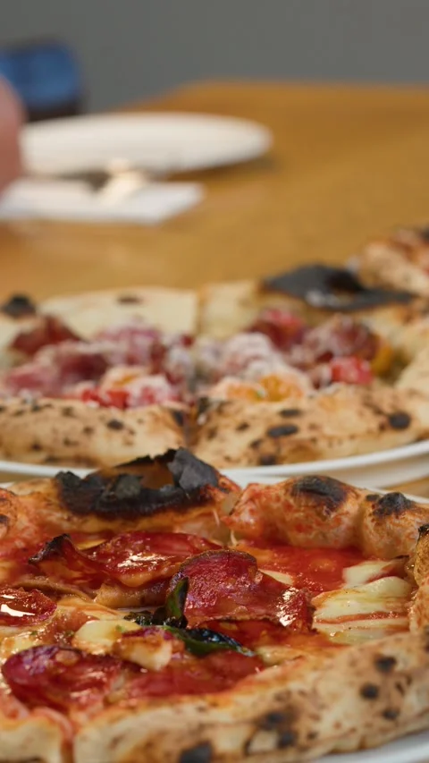 Close Up of Fresh Neapolitan Pizza Served on a Wooden Table Stock Footage 339124001