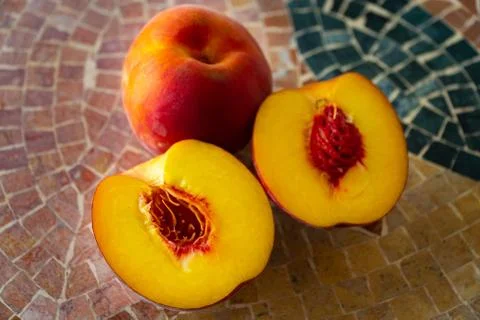 Close up of fresh nectarines on a stone table Stock Photos