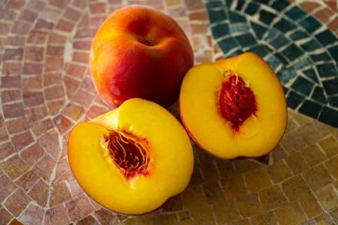 Close up of fresh nectarines on a stone table Stock Photos