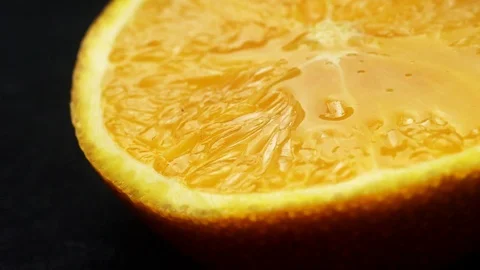 Close-up fresh orange fruit on black background Video stock 105367116