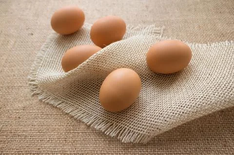 Close up of fresh organic chicken eggs from farmer market on linen tablecloth Stock Photos
