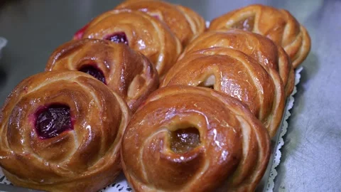 Close-up of fresh pastries on a shelf in a dining room or pastry shop. Stock Footage 318139401