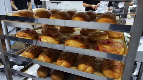 Close-up of fresh pastries on a shelf in a dining room or pastry shop. Stock Footage 341550594