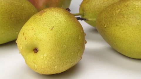 Close Up Fresh Pear Panning Right To Left On White Background Stock Footage 323586161
