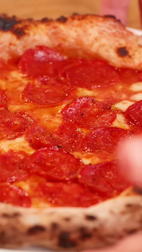 Close Up of Fresh Pepperoni Pizza Being Served on a Table Stock Footage 339513524