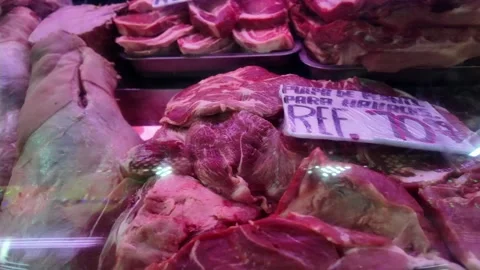Close up of fresh pork legs inside butcher shop display case in Colonia Tovar 스톡 동영상 332621945