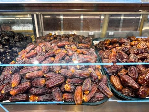 Close up of fresh premium dates arranged in a market showcase at an authentic Stock Photos
