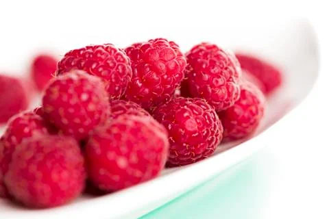 Close up of fresh raspberry on plate. Stock Photos