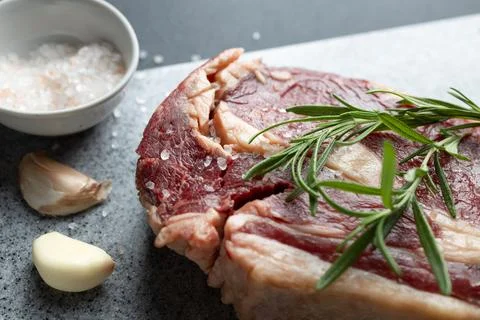 Close-up of Fresh Raw Beef Steak With Salt on Cutting Board Stock Photos