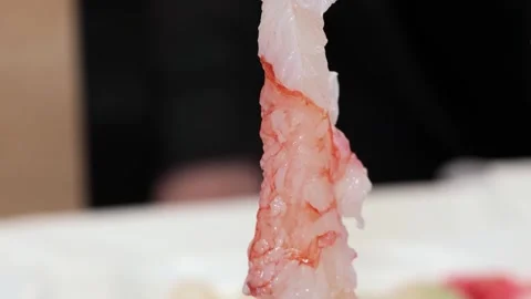 Close-up of Fresh Raw King Crab Leg Shell Cracked Open to Reveal Juicy White Mea Stock Footage 348472786
