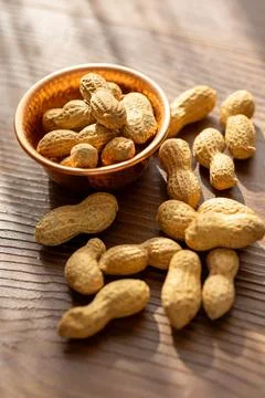 Close-up of fresh raw peanuts in a rustic copper bowl Stock Photos