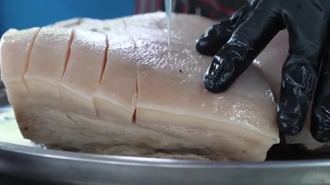 Close-up of Fresh Raw Pork Belly with Sliced Skin on Metal Tray for Barbecue Pre Stock Footage 338211073