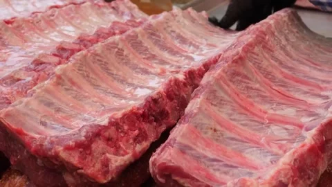 Close-up of Fresh Raw Pork Spare Ribs Prepared for Barbecue Grilling Stock Footage 338212172