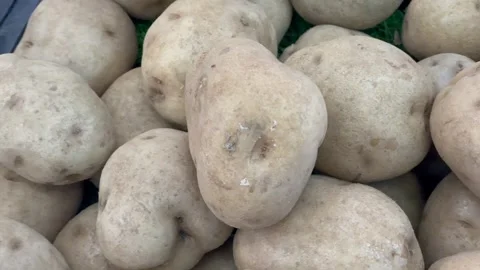 Close up of fresh raw potatoes piled up in a traditional market Stock Footage 327228759