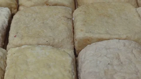 Close-up of Fresh Raw White Tofu Blocks in Traditional Market Stock Footage 328973583