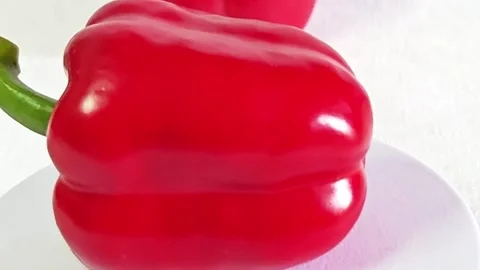 Close-up of a fresh red bell pepper on a white background. Stock Footage 340937780
