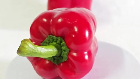 Close-up of fresh red bell pepper with green stem. Stock Footage 340937800