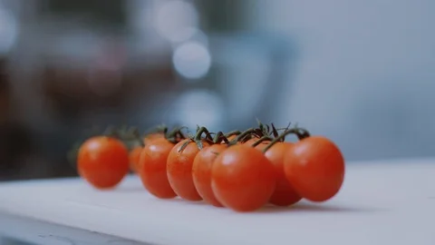 Close up fresh red cherry tomatoes on table slow motion vegetable diet healthy Stock Footage 100303141