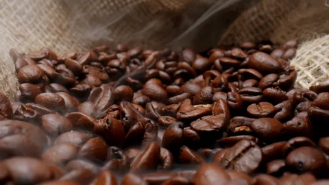 Close up of fresh roasted coffee beans in the burlap bag. Stock Footage 309364722