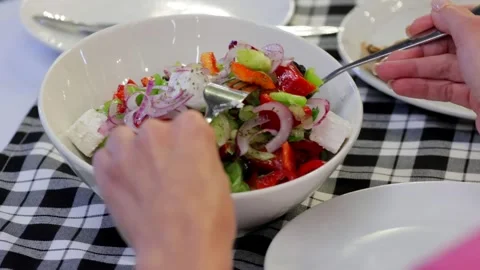 Close-Up of Fresh Salad Being Plated Stock Footage 288577047