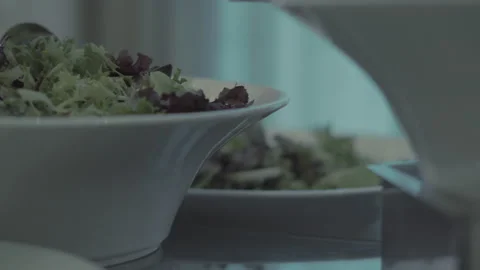 Close-up of fresh salad in elegant serving bowls 스톡 동영상 234240514