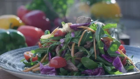 Close-up of fresh salad made of red cabbige, tomatoes, onions, basil, arugula Stock Footage 204871802