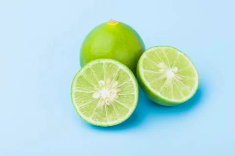 Close up fresh slice lime on blue Stock Photos