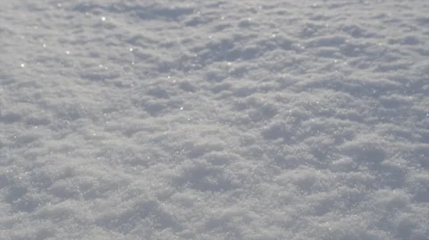 CLOSE UP: Fresh snow shinning in morning sun Stock Footage