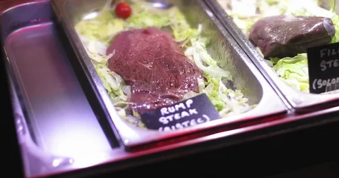 Close-up of fresh steaks in a shop window. Stock Footage 99393245