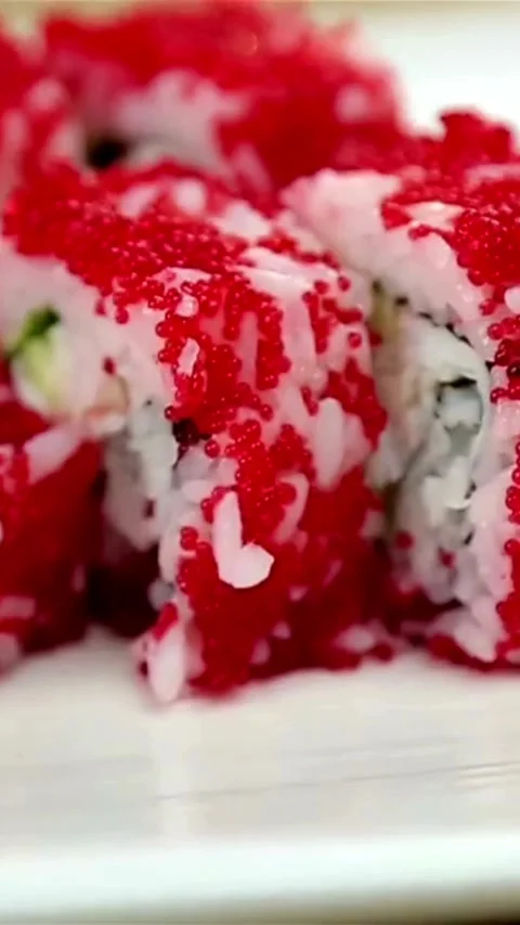 Close up of fresh sushi rolls with red roe Video stock 334183659