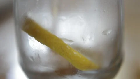 Close-up fresh tea beverage poured in a glass with lemon during a summer hot day Stock Footage 196157874